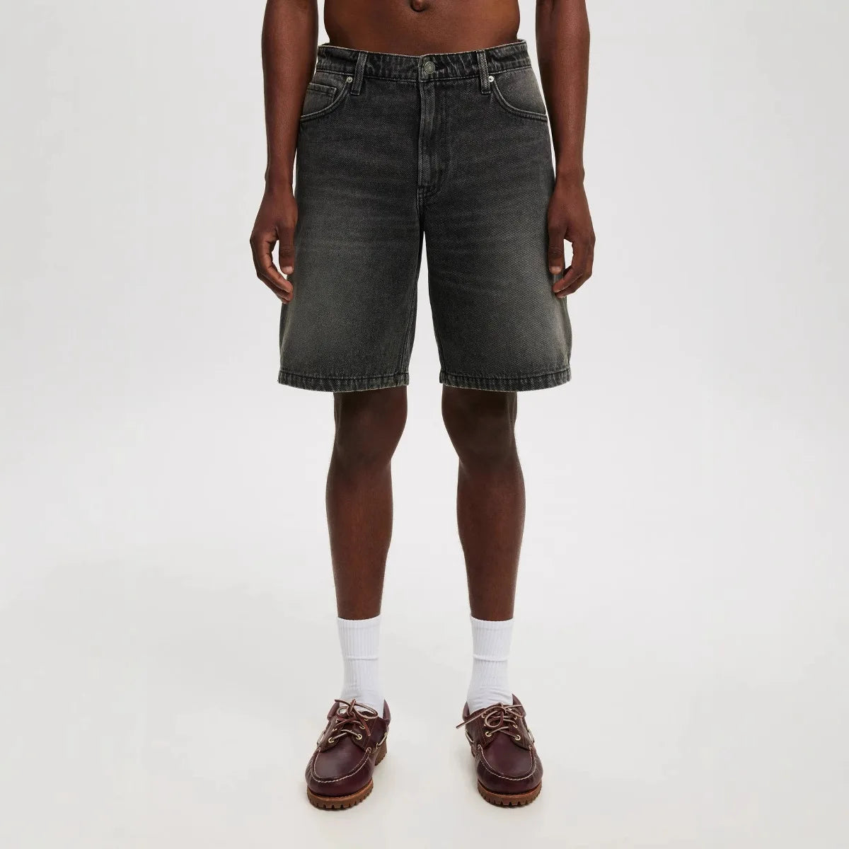 Mens denim shorts in light wash, perfect for casual summer style and comfort, featuring a relaxed fit.