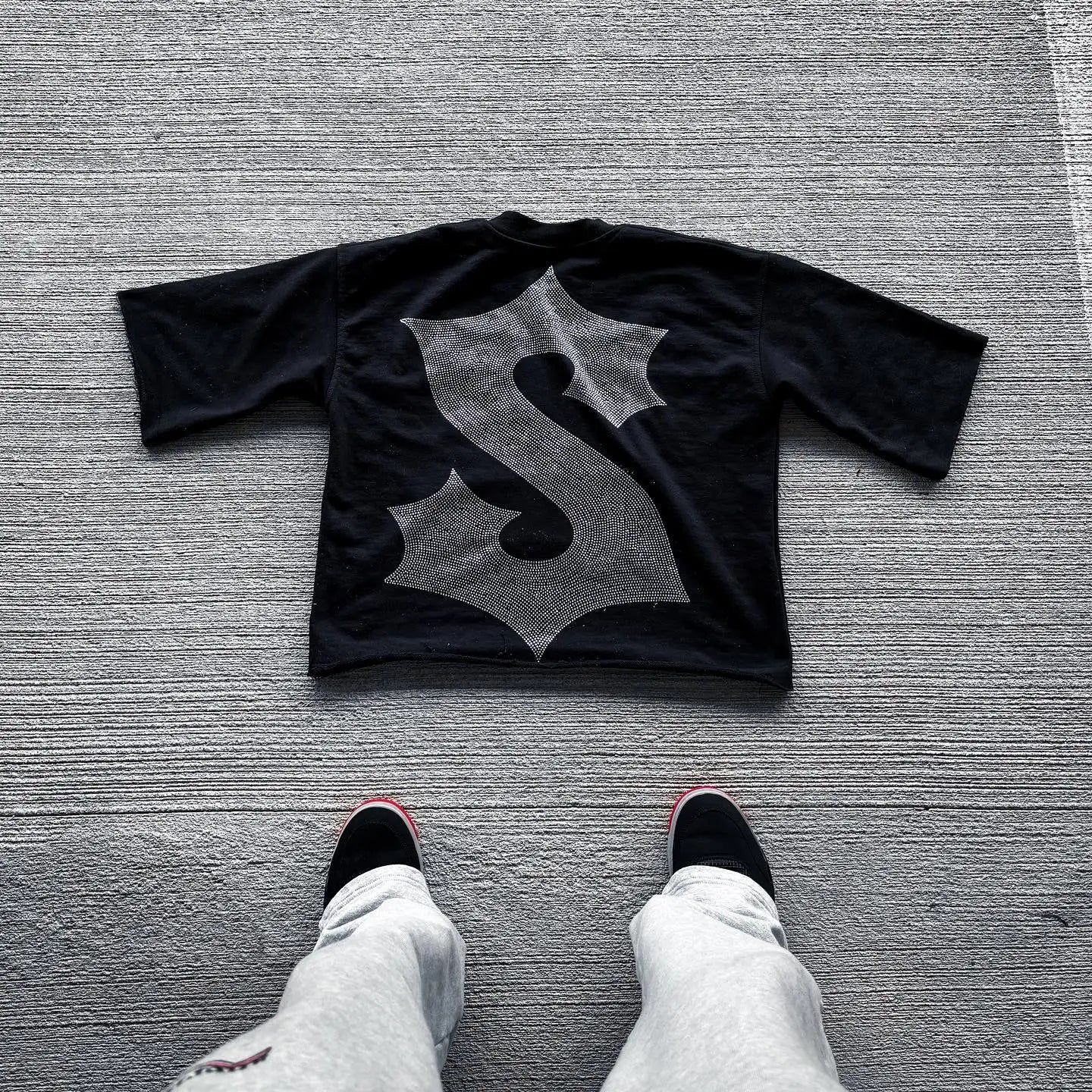 Vintage graphic t-shirt featuring a bold cross design, perfect for men and women looking for classic retro style.