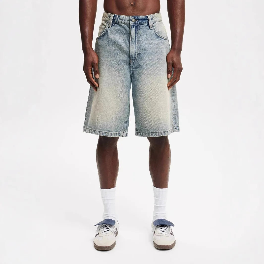 Mens denim shorts in light wash, perfect for casual summer style and comfort, featuring a relaxed fit.